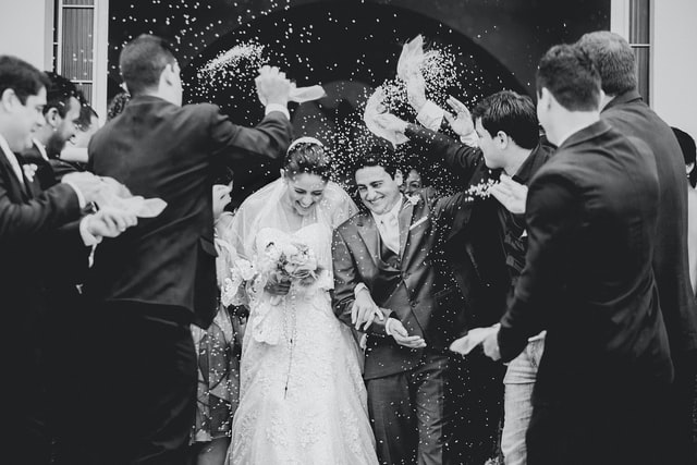 A wedding party celebrating marriage captured by wedding photographer.